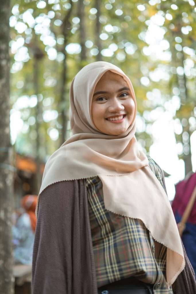 woman in white hijab and red and black plaid dress